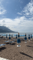 Woman enjoys morning beach visit and drive in Montenegro