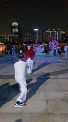 Lively summer night along the Qiantang riverfront promenade