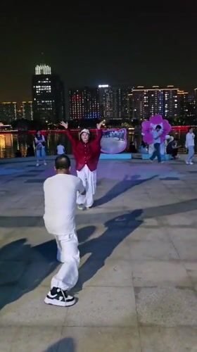 Lively summer night along the Qiantang riverfront promenade