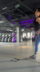 Woman exercises at Krasnoyarsk gym during morning workout session