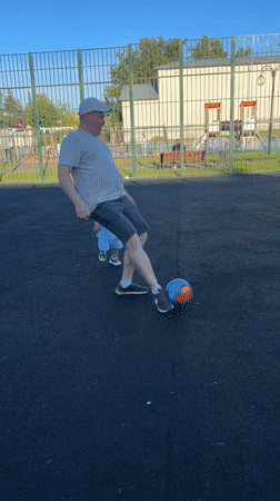 Summer afternoon at a Klin sports court, kids playing outside