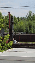 Drilling rig at work on a rural construction site in Ермолаево