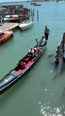 Gondolas active and docked in Venice canals