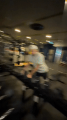 Gym selfie interrupted by surprised passerby in Thailand