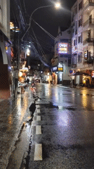 Da Lat's rain-slicked streets alive with neon and nightlife