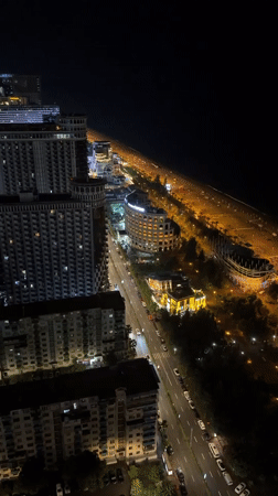 Batumi's nighttime skyline and spiral tower from above
