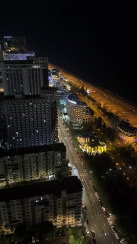 Batumi's nighttime skyline and spiral tower from above