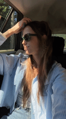 Woman enjoys car ride with wind in Montenegro
