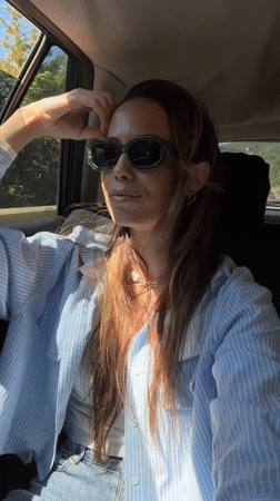 Woman enjoys car ride with wind in Montenegro