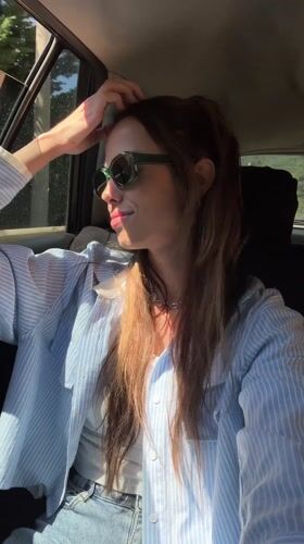 Woman enjoys car ride with wind in Montenegro