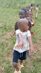 Children play traditional games in Ngalula village gathering