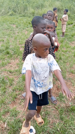 Children play traditional games in Ngalula village gathering