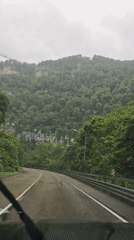 Mountain road travel and bridge crossing documented in Russia