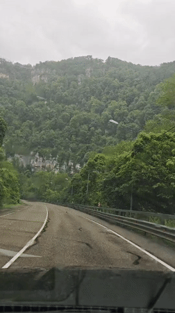 Mountain road travel and bridge crossing documented in Russia