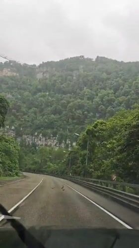 Mountain road travel and bridge crossing documented in Russia