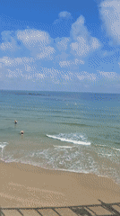 Early morning beach activities captured in Tel Aviv waters