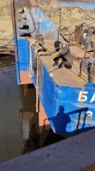 Shipyard workers maintain cargo vessel VOLGO-DON 5069 in Russia