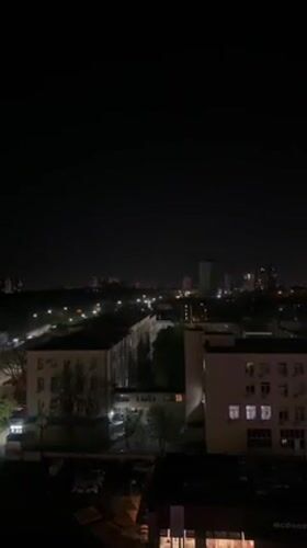 Nighttime aerial view of Kyiv buildings captured from elevated position