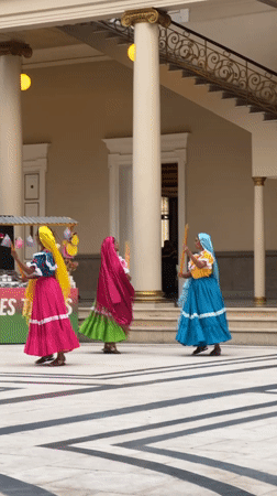 Women perform Nicaraguan folk dance in San Salvador courtyard