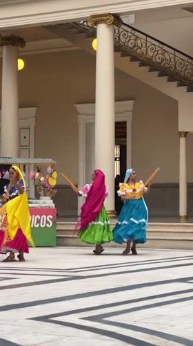 Women perform Nicaraguan folk dance in San Salvador courtyard
