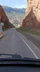 Winding road through a red-rock canyon near Naryn, Kyrgyzstan