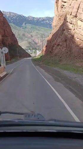 Winding road through a red-rock canyon near Naryn, Kyrgyzstan