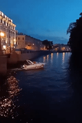 Evening boat traffic observed on Saint Petersburg canal