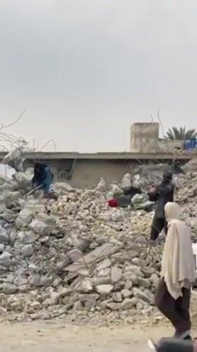 Kandahar residents clear rubble from destroyed buildings