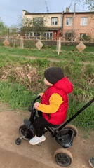 Family outing with child on tricycle documented in Фоки, Russia
