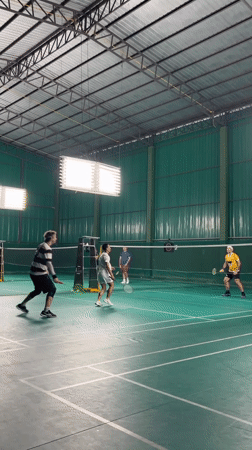 Indoor badminton matches played at Thai sports facility