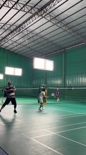 Indoor badminton matches played at Thai sports facility
