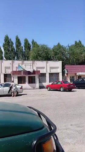 Sunny morning street activity in Koktal, Kazakhstan