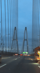Crossing a cable-stayed bridge in Saint Petersburg at dusk