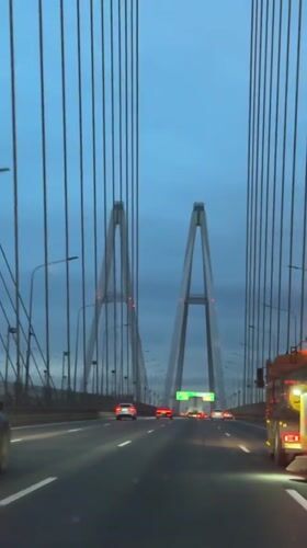 Crossing a cable-stayed bridge in Saint Petersburg at dusk