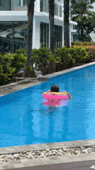 Pool and grounds activity at a Thai residential complex
