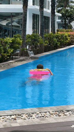 Pool and grounds activity at a Thai residential complex