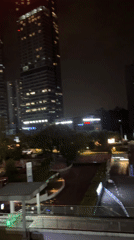 Nighttime cityscape captured from elevated view in Liangjiang, China