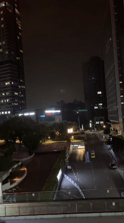 Nighttime cityscape captured from elevated view in Liangjiang, China