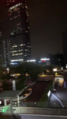 Nighttime cityscape captured from elevated view in Liangjiang, China