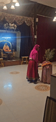 Religious gathering observed at Denpasar temple during evening hours