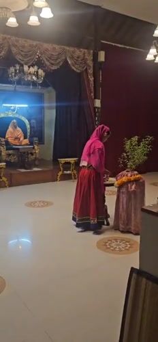 Religious gathering observed at Denpasar temple during evening hours