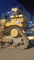 Caterpillar bulldozer parked at night in rural Kazakhstan
