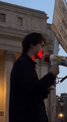 Late-night protest with megaphones near federal courthouse in Manhattan