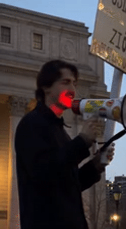 Late-night protest with megaphones near federal courthouse in Manhattan