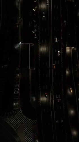 Night flight over Khimki's lit-up highways and skyline