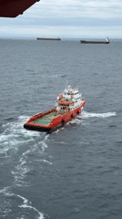 Supply boat navigates choppy waters off Italian coast