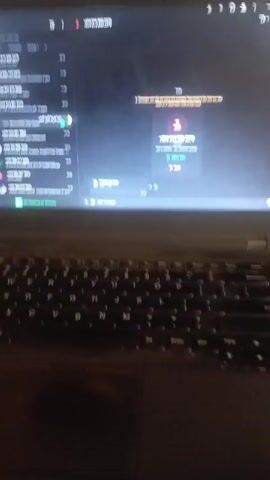 The media shows a laptop open with the WhatsApp Web interface displayed on its screen. The screen is dark, indicating a nighttime setting or a dark room. The laptop is placed on a surface that appears to be a desk or table, with a keyboard visible in the foreground.

On the WhatsApp Web screen, the left pane displays a list of contacts and group chats, indicated by profile pictures and names. The right pane shows the chat conversation with a specific contact, identified by the phone number "+234 816 899 2379". The chat history includes text messages and what appears to be file-sharing, with filenames like "Field Based Investigation Presentation 3.pptx" and "BIRTH EMPLOYEE PRODUCTIVITY.pdf". The time stamps on the messages suggest the chat is active.

Visible text includes "WhatsApp Web," "Search or start a new chat," "Group 1," and the phone number "+234 816 899 2379" in multiple places. There are also timestamps like "18:16," "17:59," "17:56," "17:17," "17:00," "16:54," and "16:00." The presence of Nigerian phone numbers (indicated by the '+234' country code) and the specified location context of Oworonshoki, Nigeria, strongly suggest the scene is taking place in Nigeria. The overall impression is of someone using WhatsApp on their laptop, likely for communication or work-related activities, at night. There are no people clearly visible in the media.