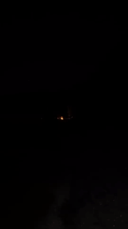 Late-night beach campfire session on the Black Sea coast.