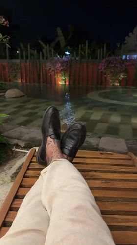 Visitor documents afternoon at Ubud resort with pools and gardens