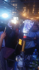 Evening celebration with cake at Nairobi bar gathering
